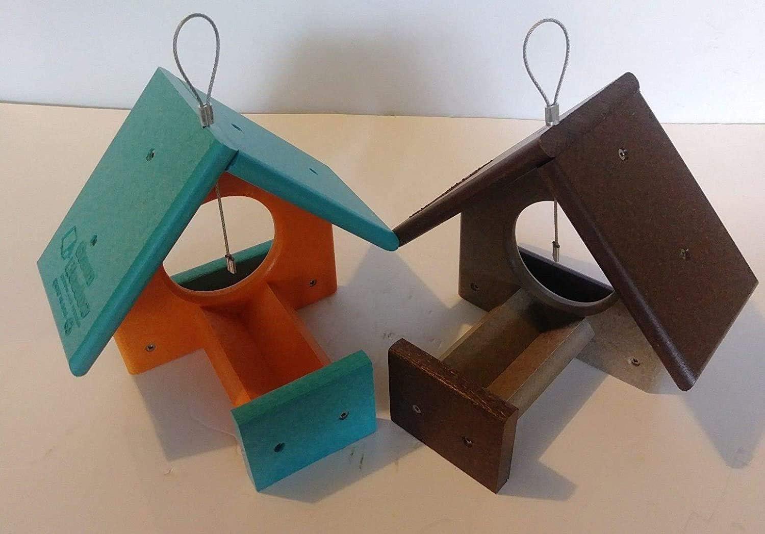 side view of peanut butter jar bird feeders showing jar openings and roof design